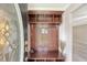 Foyer with a custom hall tree and decorative glass front door, inviting you into a carpeted living space at 102 Bristol Ln, Goose Creek, SC 29445