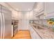 Well-lit kitchen features stainless appliances, light countertops, and lots of storage at 102 Bristol Ln, Goose Creek, SC 29445