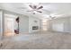 Spacious living room featuring a modern fireplace, ceiling fans, and neutral decor at 102 Bristol Ln, Goose Creek, SC 29445