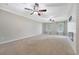 Expansive living room featuring neutral carpet, ceiling fans, and lots of natural light at 102 Bristol Ln, Goose Creek, SC 29445
