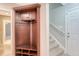 Mudroom features coat storage, bench, and shoe storage with access to stairway at 102 Bristol Ln, Goose Creek, SC 29445