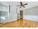 Well-lit office with built-in cabinets, shelving, and hardwood floors at 102 Bristol Ln, Goose Creek, SC 29445