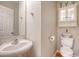 Traditional powder room with pedestal sink and matching wall cabinet at 102 Bristol Ln, Goose Creek, SC 29445