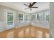 Bright sunroom with hardwood floors, large windows, and a door leading to the outside at 102 Bristol Ln, Goose Creek, SC 29445