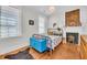 Inviting bedroom with a cozy bed, brick fireplace, and ample natural light at 103 Fishburne St, Charleston, SC 29403