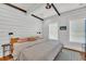 Bedroom features rustic beams, wood paneled walls, and hardwood floors at 103 Fishburne St, Charleston, SC 29403