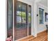 Elegant entryway featuring a wood door with glass panels and hardwood floors at 103 Fishburne St, Charleston, SC 29403