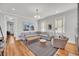 Bright living room with hardwood floors, stylish decor, and abundant natural light at 103 Fishburne St, Charleston, SC 29403