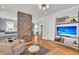 Inviting living room with exposed brick pillar, hardwood floors, and stylish decor at 103 Fishburne St, Charleston, SC 29403