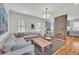 Bright living room featuring a grey sofa and view to the kitchen at 103 Fishburne St, Charleston, SC 29403