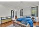 Spacious main bedroom with a mirror, hardwood floors, and a comfortable bed at 103 Fishburne St, Charleston, SC 29403