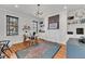 Bright office space with hardwood floors, neutral walls, and a decorative rug at 103 Fishburne St, Charleston, SC 29403