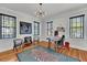 Bright office space with hardwood floors, neutral walls, and a decorative rug at 103 Fishburne St, Charleston, SC 29403