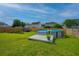 Well manicured backyard includes pool, storage shed and nicely maintained lawn at 107 Tandil Ct, Summerville, SC 29483