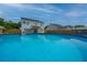 Expansive backyard featuring a large in-ground swimming pool and lush green lawn at 107 Tandil Ct, Summerville, SC 29483