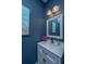 Stylish bathroom featuring blue walls, modern fixtures, and a decorative vanity at 107 Tandil Ct, Summerville, SC 29483