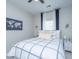 Cozy bedroom featuring a plush bed with patterned bedding, bedside table, and stylish wall art at 107 Tandil Ct, Summerville, SC 29483