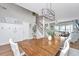 Open-concept dining area featuring a large table, staircase, and contemporary light fixture at 107 Tandil Ct, Summerville, SC 29483
