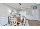 Bright dining room featuring a large table, modern lighting, and elegant trim at 107 Tandil Ct, Summerville, SC 29483