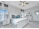 Spacious main bedroom with tray ceiling, large windows, and ensuite bathroom access at 107 Tandil Ct, Summerville, SC 29483