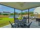 Covered patio with an outdoor dining area, overlooking the backyard and above ground swimming pool at 107 Tandil Ct, Summerville, SC 29483