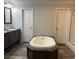 Spacious bathroom featuring a soaking tub, double sink vanity, and modern fixtures at 110 Kay St, Ridgeville, SC 29472
