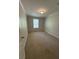 Cozy bedroom with neutral carpet, one window, and a minimalist aesthetic at 110 Kay St, Ridgeville, SC 29472
