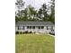 Charming ranch-style home with a well-maintained front lawn and inviting curb appeal at 110 Kay St, Ridgeville, SC 29472