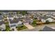 Wide aerial shot of a suburban neighborhood with a two-story home indicated by a red arrow at 110 Ricewood Ln, Moncks Corner, SC 29461