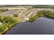 Aerial view showcases the community's lakefront location and amenities like a pool and playground at 110 Ricewood Ln, Moncks Corner, SC 29461