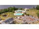 Aerial view of community pool, dock, lake, clubhouse, playground, parking and condos at 110 Ricewood Ln, Moncks Corner, SC 29461