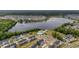 Aerial view shows neighborhood amenities like a pool, clubhouse, and lake access at 110 Ricewood Ln, Moncks Corner, SC 29461