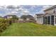 The home features a large, lush backyard with a wooden fence and partial landscaping at 110 Ricewood Ln, Moncks Corner, SC 29461