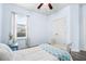 Bright bedroom features blue accents, and a view from the window at 110 Ricewood Ln, Moncks Corner, SC 29461