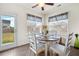 Cozy breakfast nook with a round wooden table and a view of the backyard at 110 Ricewood Ln, Moncks Corner, SC 29461