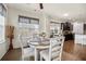 Breakfast nook with wood table and seating, large windows with backyard view at 110 Ricewood Ln, Moncks Corner, SC 29461