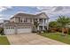 Charming two-story home with a three-car garage and manicured lawn at 110 Ricewood Ln, Moncks Corner, SC 29461