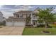 Beautiful two-story home featuring a three-car garage and well-kept lawn at 110 Ricewood Ln, Moncks Corner, SC 29461