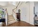 Bright foyer with hardwood floors, a staircase, and neutral decor at 110 Ricewood Ln, Moncks Corner, SC 29461