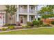 Inviting front porch with decorative columns, landscaping, and 'HELLO' sign at 110 Ricewood Ln, Moncks Corner, SC 29461