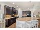 Spacious kitchen with granite countertops, stainless steel appliances, and dark wood cabinetry at 110 Ricewood Ln, Moncks Corner, SC 29461