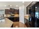 Kitchen featuring granite countertops, dark wood cabinets, and stainless steel appliances at 110 Ricewood Ln, Moncks Corner, SC 29461