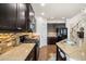 Kitchen with granite counters, dark cabinetry, stainless steel appliances, and wood floors at 110 Ricewood Ln, Moncks Corner, SC 29461