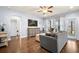 Bright living room features hardwood floors, modern furniture, and a ceiling fan at 110 Ricewood Ln, Moncks Corner, SC 29461