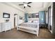 Spacious main bedroom with a king bed, neutral decor, and tray ceiling at 110 Ricewood Ln, Moncks Corner, SC 29461