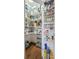 Walk-in pantry with organized shelving, filled with a variety of food and household items at 110 Ricewood Ln, Moncks Corner, SC 29461