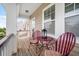 Charming porch area featuring outdoor furniture, ideal for relaxing and enjoying the scenery at 110 Ricewood Ln, Moncks Corner, SC 29461