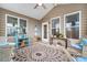 Cozy sunroom with neutral finishes, a ceiling fan, and ample natural light at 110 Ricewood Ln, Moncks Corner, SC 29461
