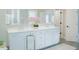 Modern bathroom with double vanity, white cabinetry, and stylish fixtures at 1100 Saltwater Cir, Johns Island, SC 29455