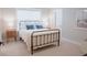 Cozy bedroom with a metal frame bed, soft bedding, and a serene ambiance at 1100 Saltwater Cir, Johns Island, SC 29455